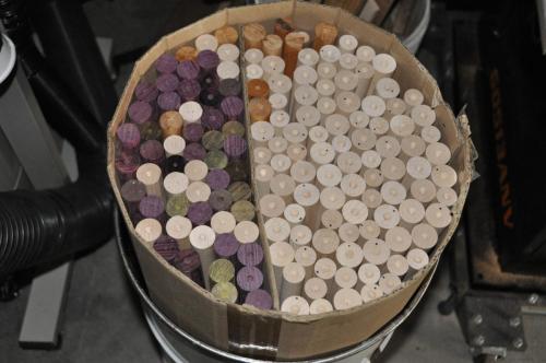 A barrel of first cut shafts and cores.  Maple, Purpleheart, Lignum Vitae and Goncolo Alves